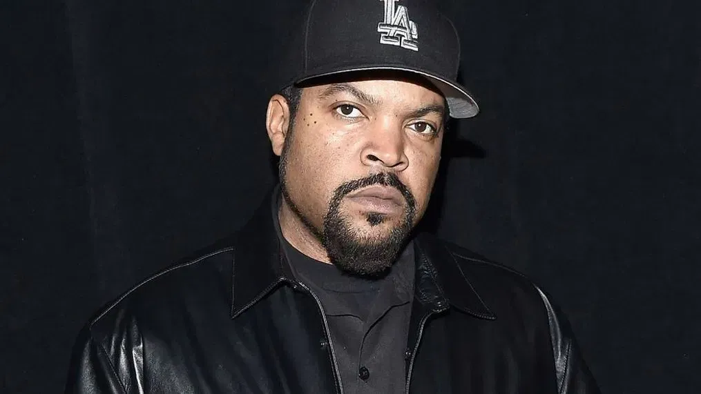 Ice Cube in front of a Friday movie poster – iconic film franchise creator
