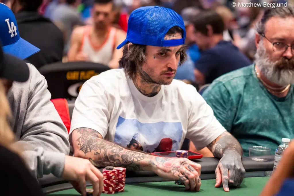 Mikki Mase at a high-stakes casino table with poker chips and cash stacks”